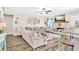 Spacious living room boasts a brick fireplace, stylish furniture, and lots of natural light at 180 Allie Dr, Mcdonough, GA 30252