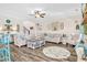 Large living room with an open floor plan, ceiling fan, fireplace and comfortable seating at 180 Allie Dr, Mcdonough, GA 30252