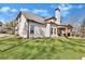 A two-story brick house with a covered porch, a manicured lawn, and mature trees at 180 Allie Dr, Mcdonough, GA 30252