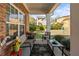 Cozy back porch with seating, views of the backyard, and natural light at 230 Rosenwald Ln, Hampton, GA 30228