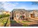 Brick patio featuring outdoor seating in a well-maintained backyard surrounded by lush greenery at 230 Rosenwald Ln, Hampton, GA 30228