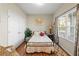 Cozy bedroom with a comfortable bed, natural light, and a closet at 230 Rosenwald Ln, Hampton, GA 30228