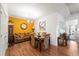 Elegant dining room with a stylish table set, accent wall, and ample natural light at 230 Rosenwald Ln, Hampton, GA 30228
