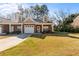 Attractive brick home with a two car garage and well-maintained lawn at 230 Rosenwald Ln, Hampton, GA 30228