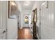 Entryway featuring hardwood floors, neutral walls, and decor at 230 Rosenwald Ln, Hampton, GA 30228