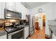 Well-equipped kitchen with stainless steel appliances, granite countertops, and abundant storage at 230 Rosenwald Ln, Hampton, GA 30228