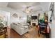 Inviting living room with fireplace, plush seating, and stylish decor accents at 230 Rosenwald Ln, Hampton, GA 30228