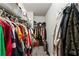 Spacious walk-in closet with ample shelving and hanging space for clothes and storage at 230 Rosenwald Ln, Hampton, GA 30228