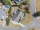 Aerial view showcasing the backyard, landscaping, driveway and the surrounding neighborhood at 302 Meadow Lark Xing, Canton, GA 30114