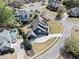 Aerial view of neighborhood with pool, trees and landscaping surrounded by residential homes on a cul-de-sac at 302 Meadow Lark Xing, Canton, GA 30114