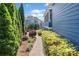 Landscaped backyard pathway leading to the home's exterior at 302 Meadow Lark Xing, Canton, GA 30114