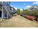 Large backyard with staircase to second floor deck at 302 Meadow Lark Xing, Canton, GA 30114