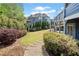 Lush backyard with manicured landscaping and multi-level deck at 302 Meadow Lark Xing, Canton, GA 30114