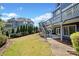 Picturesque backyard featuring lush lawn and a beautiful landscape design at 302 Meadow Lark Xing, Canton, GA 30114