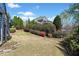 Expansive backyard with mature trees and elegant landscaping at 302 Meadow Lark Xing, Canton, GA 30114