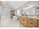 Bright bathroom with soaking tub, glass shower, and double vanity at 302 Meadow Lark Xing, Canton, GA 30114