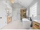 Modern bathroom with soaking tub, glass shower, and wood-tone vanity at 302 Meadow Lark Xing, Canton, GA 30114