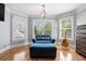 Sitting area with windows, hardwood floors, and modern chandelier at 302 Meadow Lark Xing, Canton, GA 30114