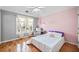 Bright bedroom featuring hardwood floors and lots of natural light at 302 Meadow Lark Xing, Canton, GA 30114