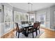 Stylish dining room with hardwood floors and modern lighting at 302 Meadow Lark Xing, Canton, GA 30114