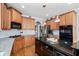 Modern kitchen featuring hardwood floors, stone countertops and stainless appliances at 302 Meadow Lark Xing, Canton, GA 30114