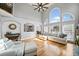 Bright living room with cathedral ceilings, large windows and hardwood floors at 302 Meadow Lark Xing, Canton, GA 30114