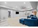 Comfortable living room features modern flooring, lots of natural light, a TV, and cozy seating at 302 Meadow Lark Xing, Canton, GA 30114