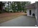 Back patio with retaining wall provides a relaxing outdoor space at 3020 Templeton Ln, Loganville, GA 30052
