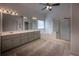 Large bathroom with double vanity, jacuzzi tub, glass block accent, and private shower at 3020 Templeton Ln, Loganville, GA 30052