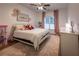 Bright bedroom with cozy decor, decorative pillows, and stylish curtains at 3020 Templeton Ln, Loganville, GA 30052