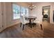 Cozy dining nook features a round table, white chairs and ample natural light from a window at 3020 Templeton Ln, Loganville, GA 30052