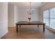 Formal dining room with wood flooring, a rustic table, and wainscoting at 3020 Templeton Ln, Loganville, GA 30052