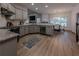 Open-concept kitchen featuring stainless steel appliances, granite countertops, and a cozy breakfast nook at 3020 Templeton Ln, Loganville, GA 30052