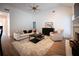 Comfortable living area with vaulted ceilings, a cozy seating arrangement, and a fireplace at 3020 Templeton Ln, Loganville, GA 30052