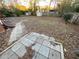 Backyard with concrete patio, wooden privacy fence, and two storage sheds at 488 Mcwilliams Se Ave, Atlanta, GA 30316