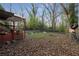 Large backyard features a deck, patio furniture, and mature trees at 1090 Harwell Nw St, Atlanta, GA 30314