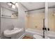 Bathroom features a shower-tub combination with white fixtures and tile surround at 1090 Harwell Nw St, Atlanta, GA 30314