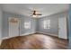 Bright bedroom with new hardwood floors, neutral walls, ceiling fan, and two windows for natural light at 1090 Harwell Nw St, Atlanta, GA 30314