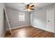 Cozy bedroom with hardwood floors, a ceiling fan, and a closet for storage at 1090 Harwell Nw St, Atlanta, GA 30314