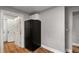 Kitchen corner features a black refrigerator and access to an additional room at 1090 Harwell Nw St, Atlanta, GA 30314