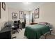 Versatile bedroom with an area for sleeping and a desk setup for work at 1917 Baxley Pine Trce, Suwanee, GA 30024