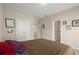 Neutral bedroom with double closets and views into other rooms in the house at 1917 Baxley Pine Trce, Suwanee, GA 30024