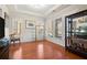 Well-lit living room boasting hardwood floors, stylish furnishings, and large windows at 1917 Baxley Pine Trce, Suwanee, GA 30024