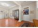 Bright, spacious living room featuring hardwood floors, tray ceilings, and abundant natural light at 1917 Baxley Pine Trce, Suwanee, GA 30024