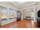 Bright and airy living room with hardwood floors, tray ceilings, and large windows at 1917 Baxley Pine Trce, Suwanee, GA 30024
