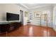 Bright and spacious living room featuring hardwood floors, ample natural light, and stylish decor at 1917 Baxley Pine Trce, Suwanee, GA 30024