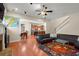 Bright and inviting living room with hardwood floors and an open view to the kitchen at 1917 Baxley Pine Trce, Suwanee, GA 30024