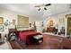 Spacious main bedroom with tray ceilings, large carpet, and a seating area at 1917 Baxley Pine Trce, Suwanee, GA 30024