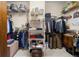 Walk-in closet with clothing racks, shelving, and built-in storage at 1917 Baxley Pine Trce, Suwanee, GA 30024