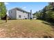 Large backyard featuring a well-maintained lawn, mature trees, and a deck at 1979 Resting Creek Dr, Decatur, GA 30035
